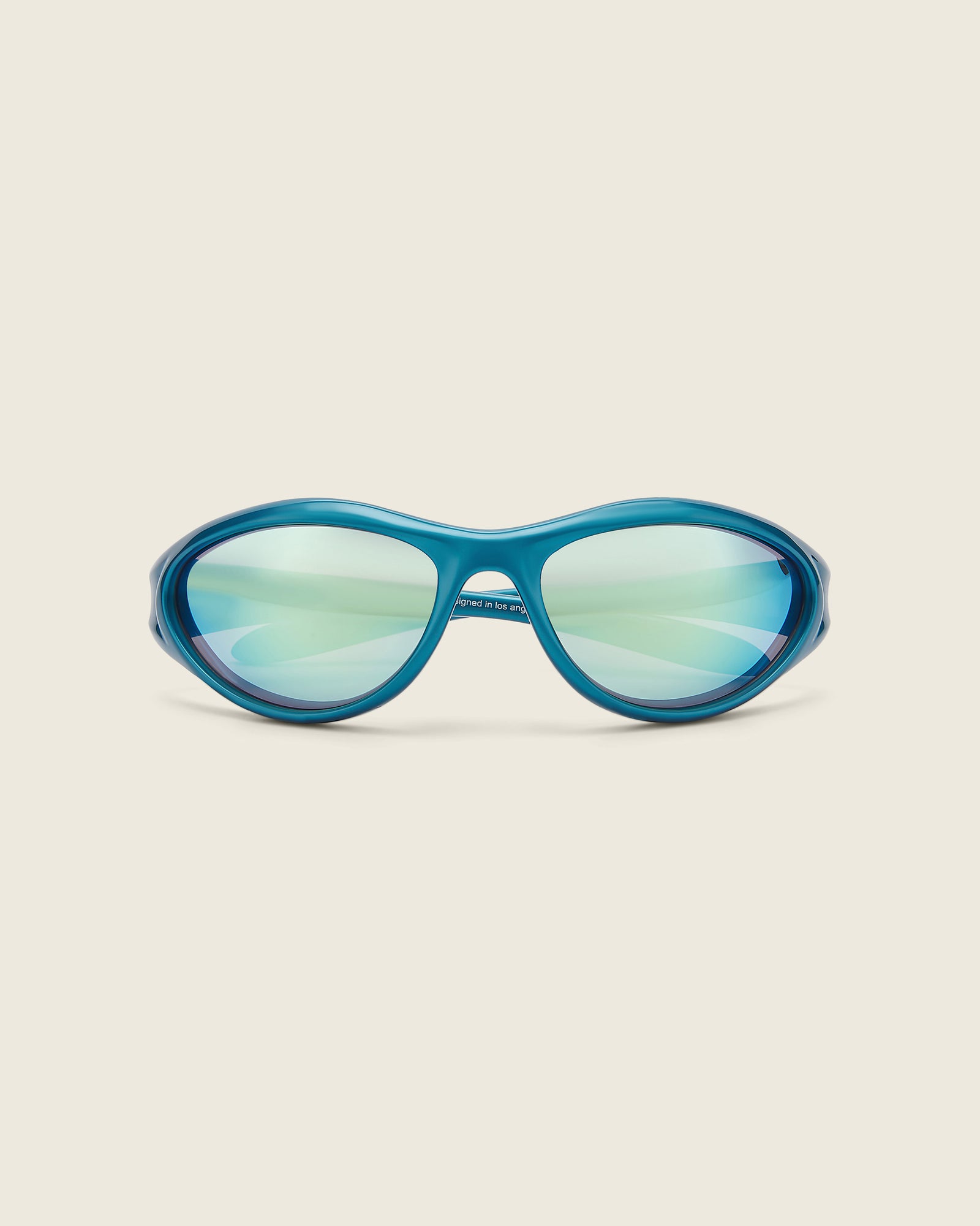 Bonnie Clyde Angel metallic blue curved TR90 sunglasses with blue lenses, face view.