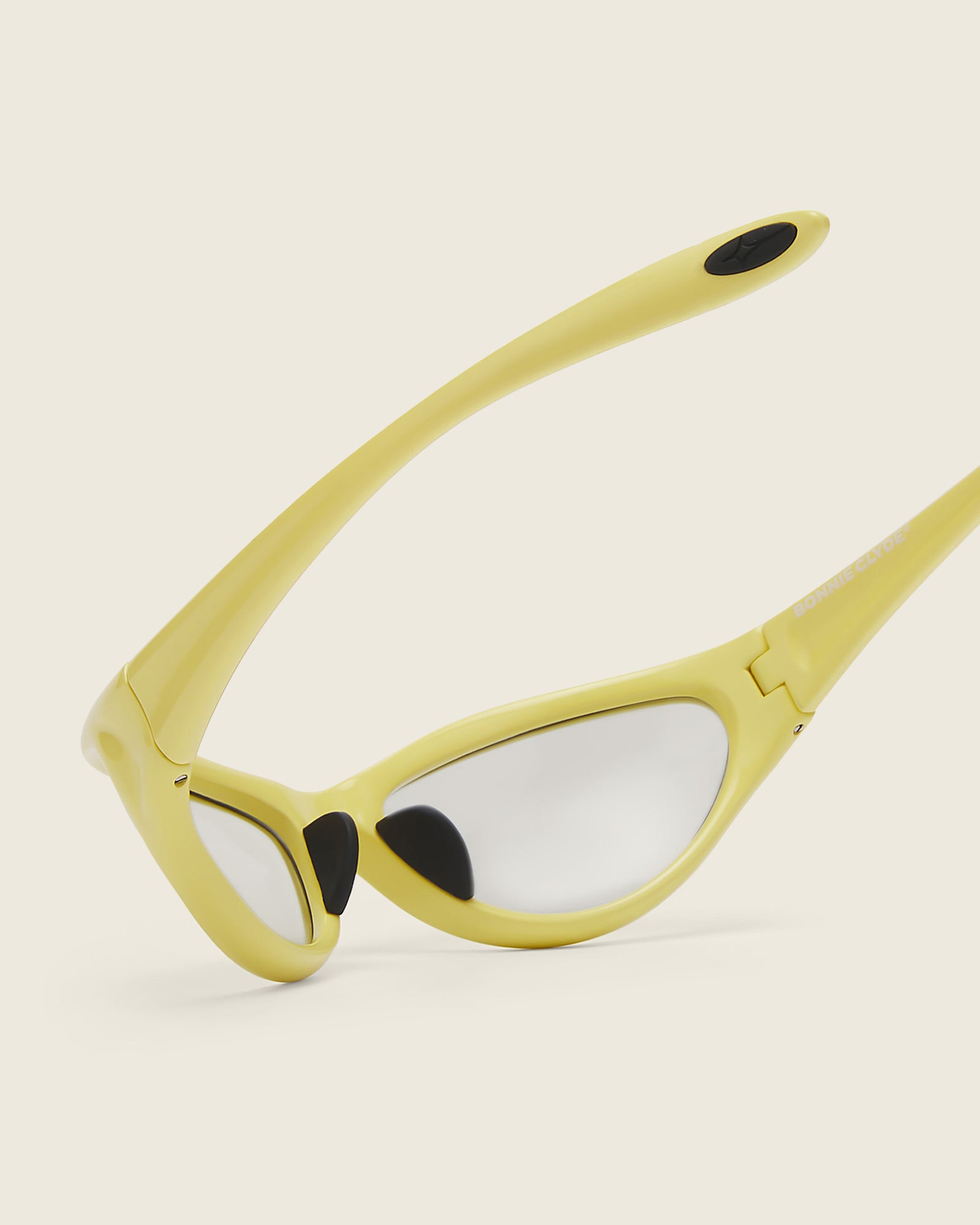 Bonnie Clyde Angel aviator opticals in yellow TR90 with grey lenses, detail view.