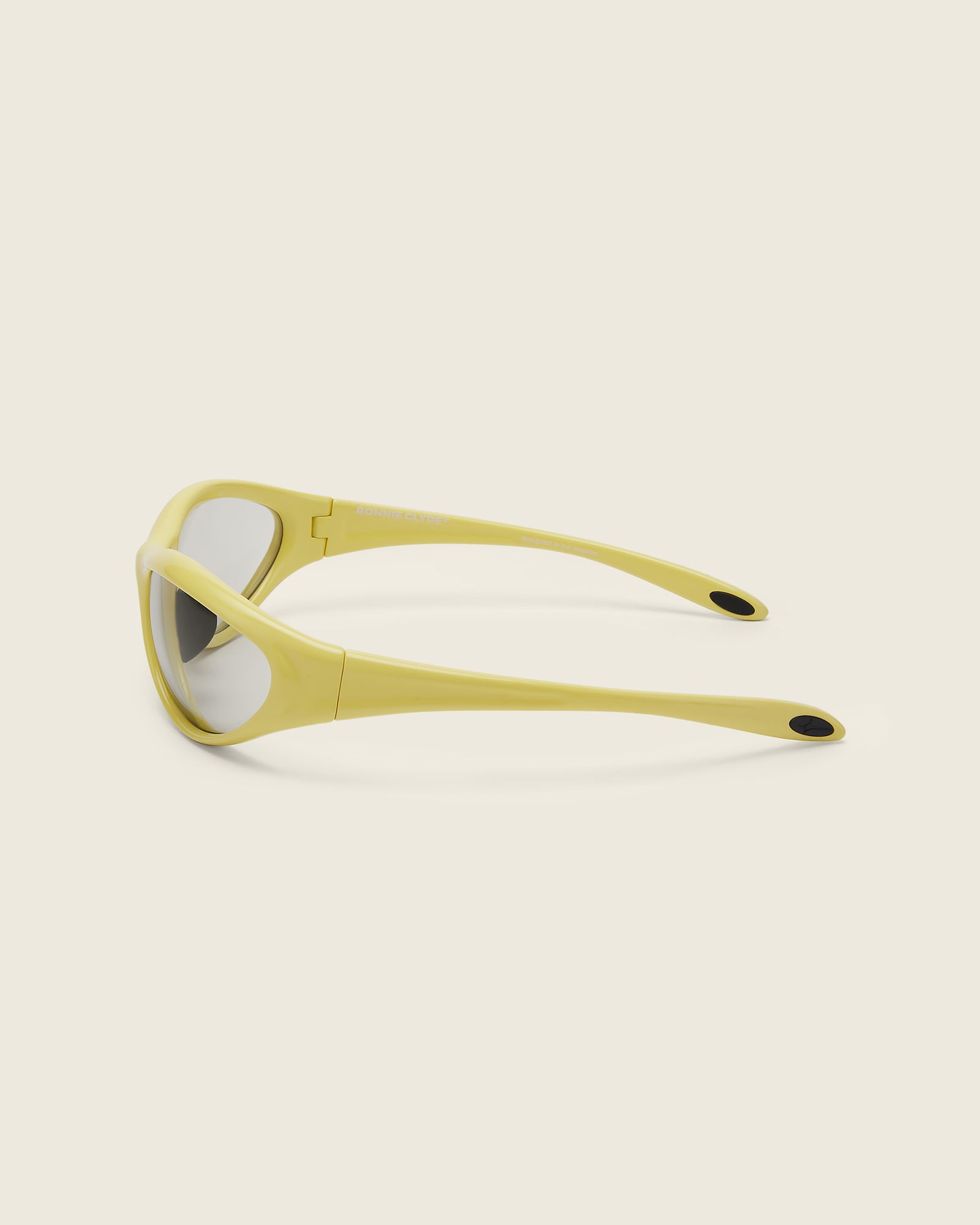 Bonnie Clyde Angel aviator opticals in yellow TR90 with grey lenses, quarter view.
