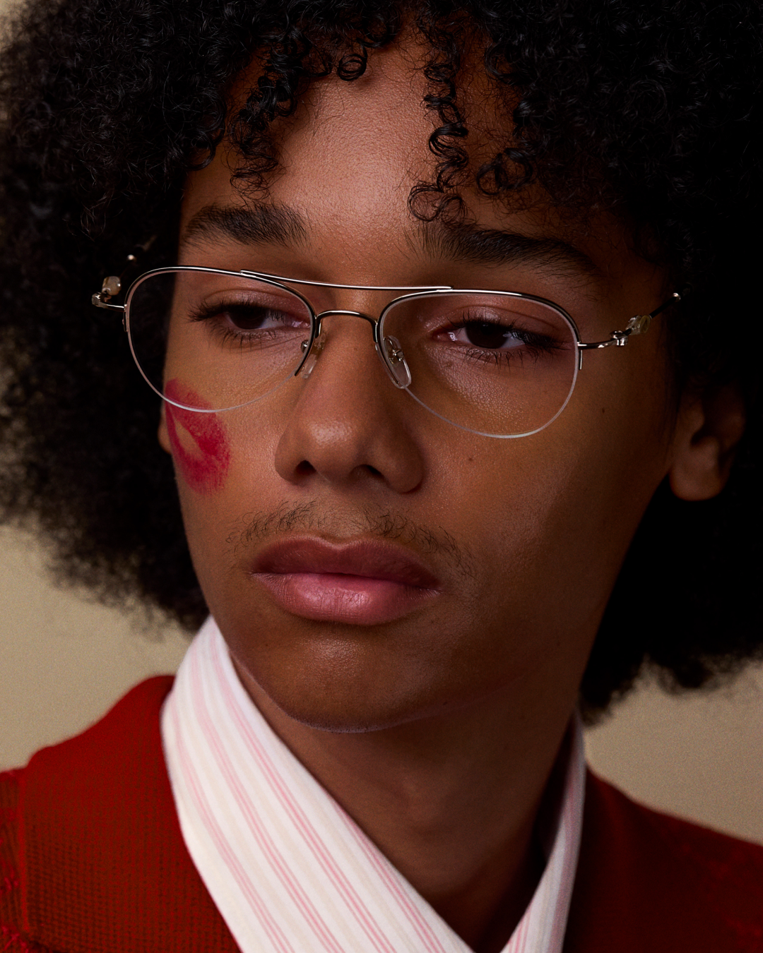 Bonnie Clyde Autobio aviator opticals in silver titanium with  blue light filtering lenses and exploding heart acetate bead detailing on the arms, on a model's face.