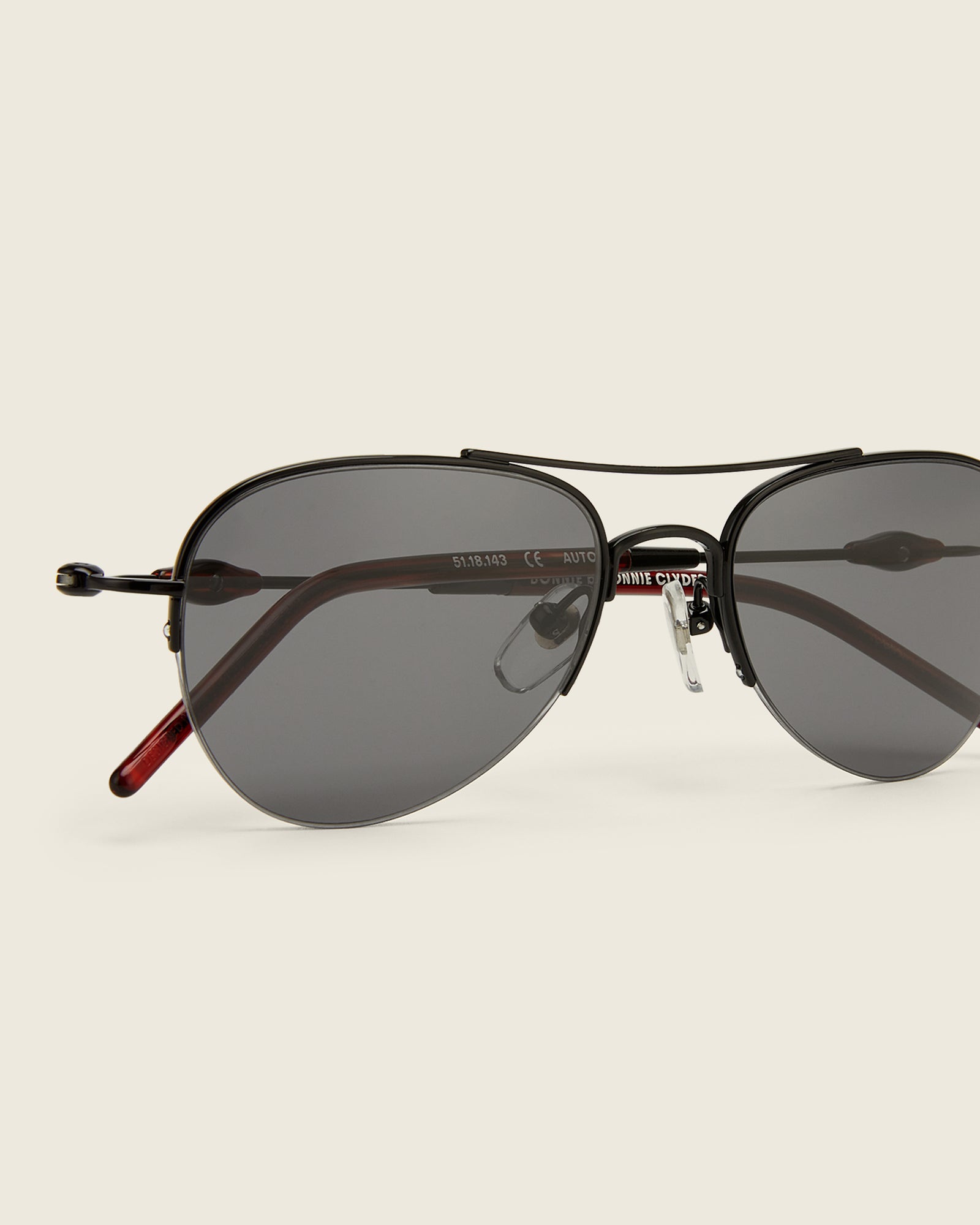 Bonnie Clyde Autobio aviator opticals in black titanium with black lenses and exploding heart acetate bead detailing on the arms, detail view.