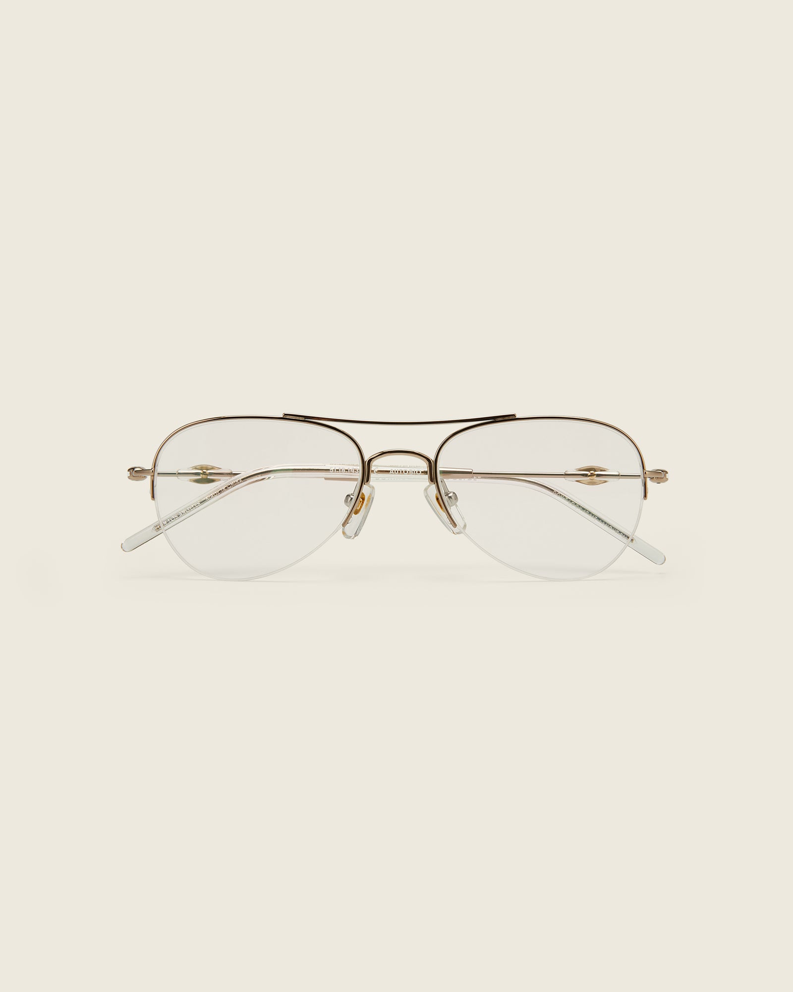 Bonnie Clyde Autobio aviator opticals in gold titanium with clear lenses and exploding heart acetate bead detailing on the arms, face view.