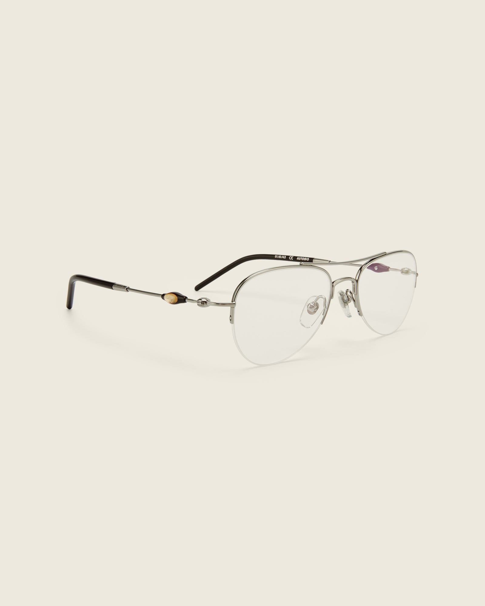 Bonnie Clyde Autobio aviator opticals in silver titanium with  blue light filtering lenses and exploding heart acetate bead detailing on the arms,, quarter view.