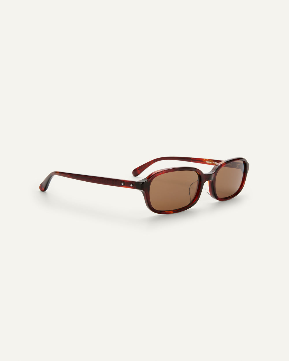 Quarter shot of Bonnie Clyde Comedy sunglasses in Red Tort.