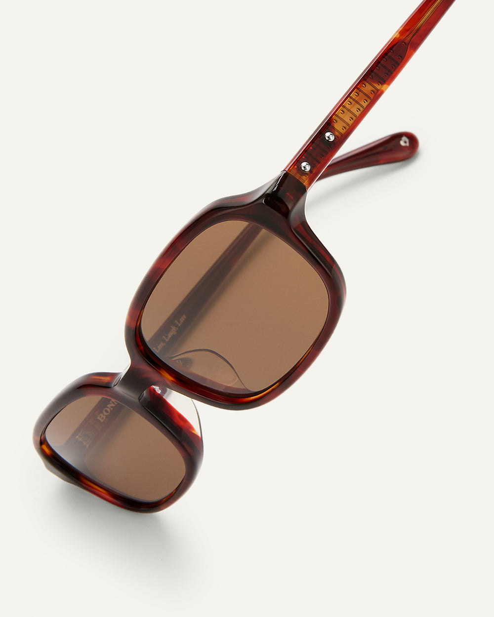 Side shot of Bonnie Clyde Comedy sunglasses in Red Tort.