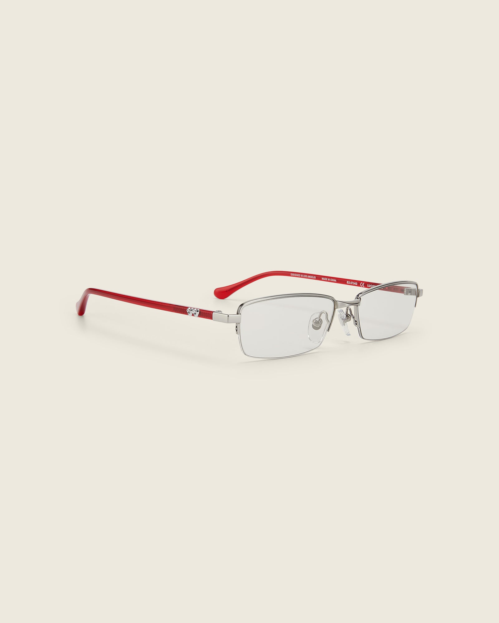 Bonnie Clyde Lucky Star Glasses. Silver frames with clear lenses and red arm temples.