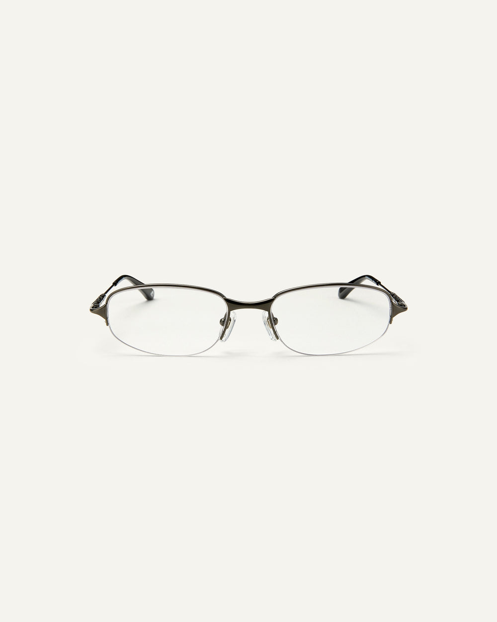 Face shot of Bonnie Clyde Outro eyeglasses in gunmetal titanium frames with black acetate details and clear lenses.