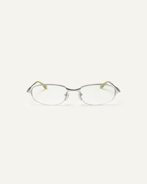 Face shot of Bonnie Clyde Outro eyeglasses in silver titanium frames with green acetate details and clear lenses.