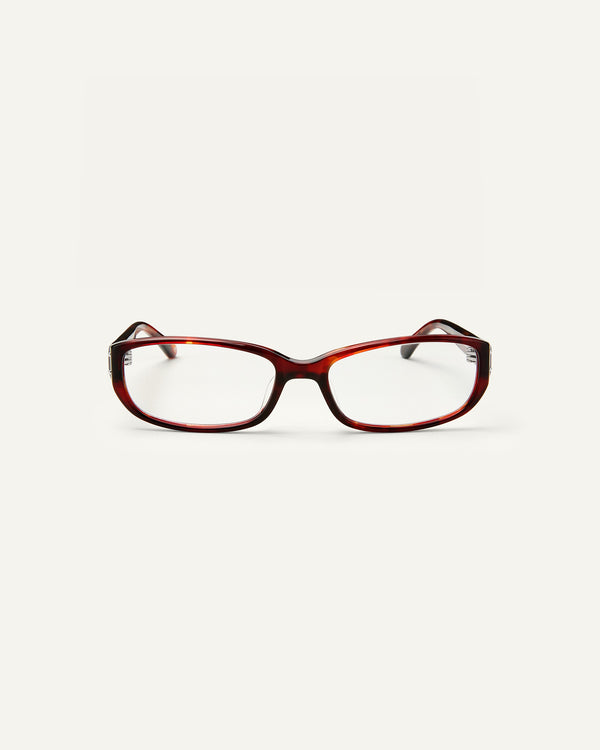 Face shot of Bonnie Clyde Triplet eyeglasses in red tortoise frames with clear lenses.
